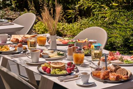 Breakfast table on the terrace at Hôtel Athena Spa in Strasbourg