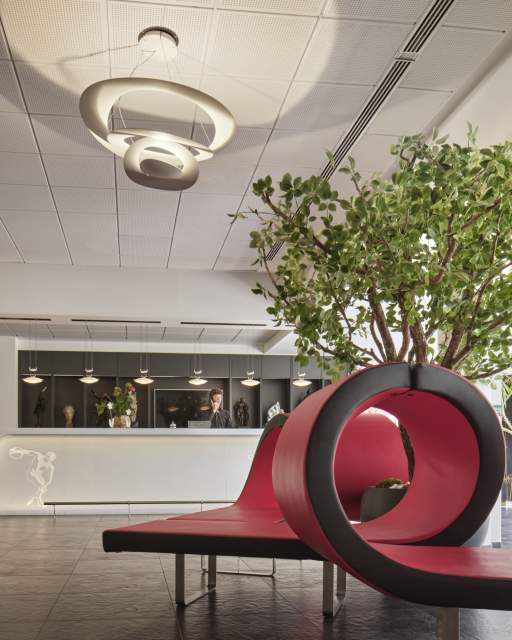 Reception hall with red designer seating at Hôtel Athena Spa in Strasbourg