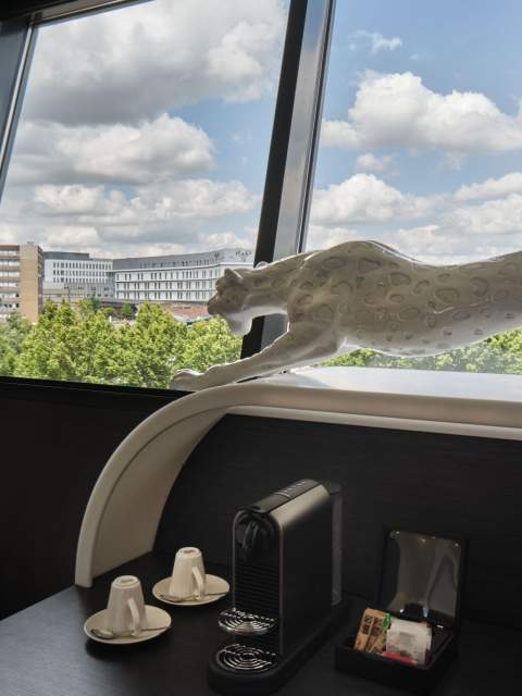 Double bed with desk and window in a room at Hôtel Athena Spa in Strasbourg