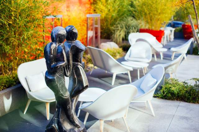 Outdoor terrace with designer furniture at Hôtel Athena Spa in Strasbourg