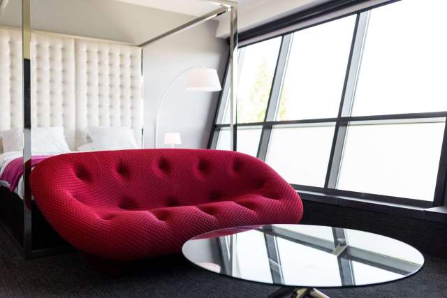 Designer sofa in a room at Hôtel Athena Spa in Strasbourg